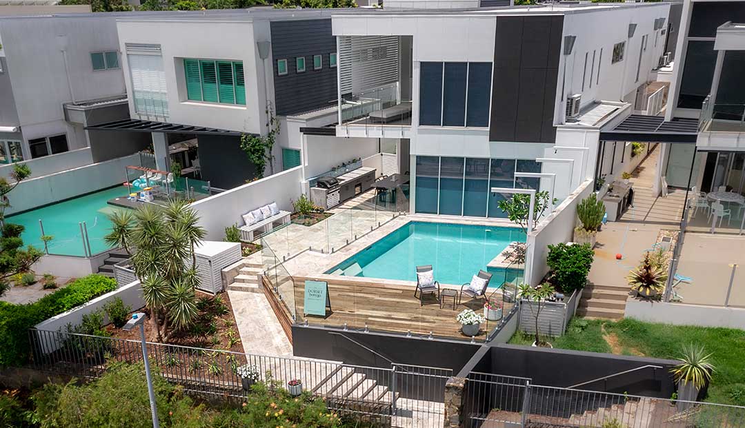 Aerial view of a Bulimba Brisbane home with pool, deck, and outdoor kitchen.