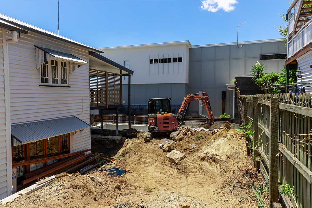 Construction site with machinery and debris.