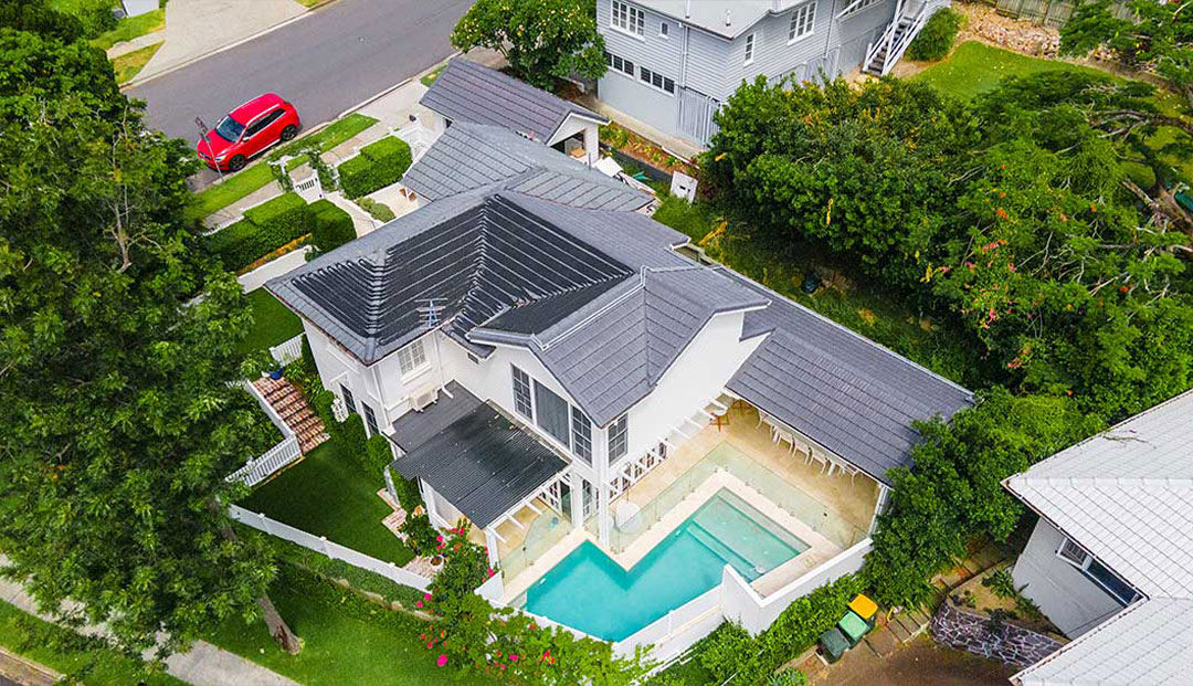 Geelong Street, Brisbane aerial shot of a home with a pool and solar panels.