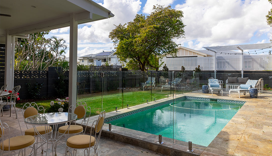 Patio dining set by a pool in Gordon Street, Brisbane.