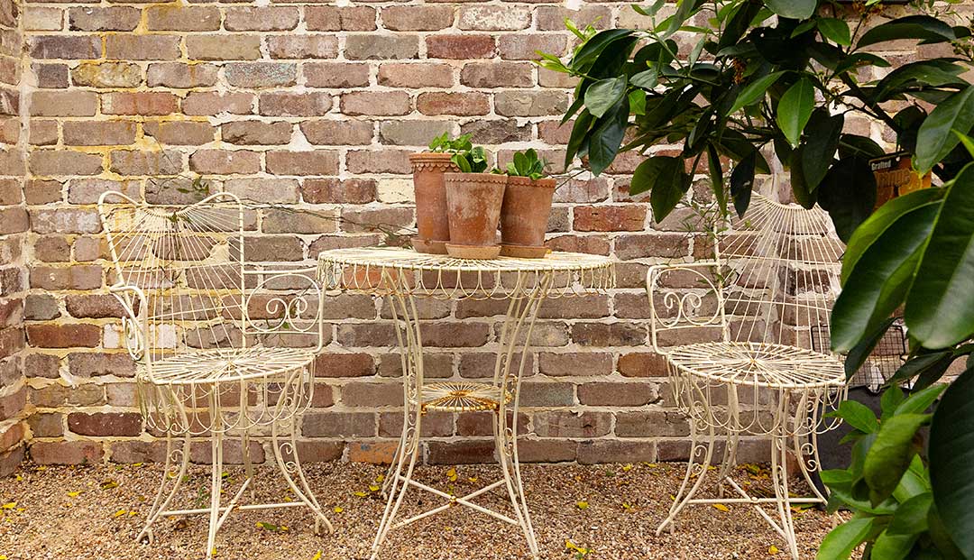 Quaint garden set against a recycled brick wall at Hazelmere Parade, Brisbane.