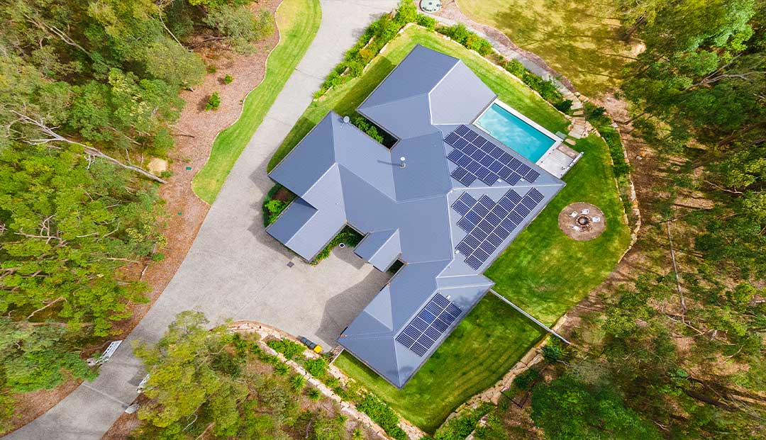 Top-down view of an eco-friendly home with pool on Prout Street, Brisbane.