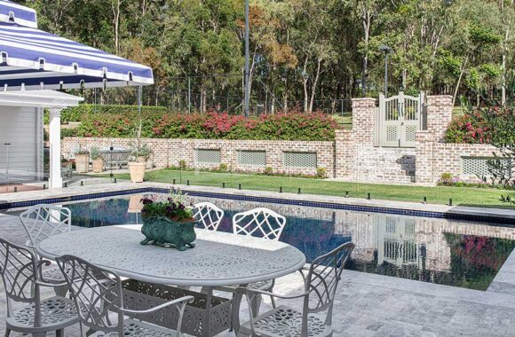 Luxurious poolside with a tennis court in Brisbane