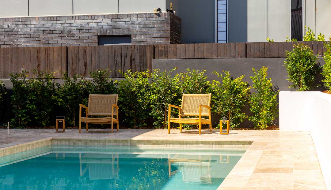 Poolside seating with a bespoke lantern.